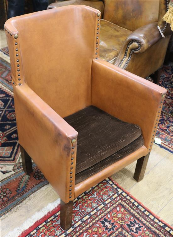 A small tan leatherette chair